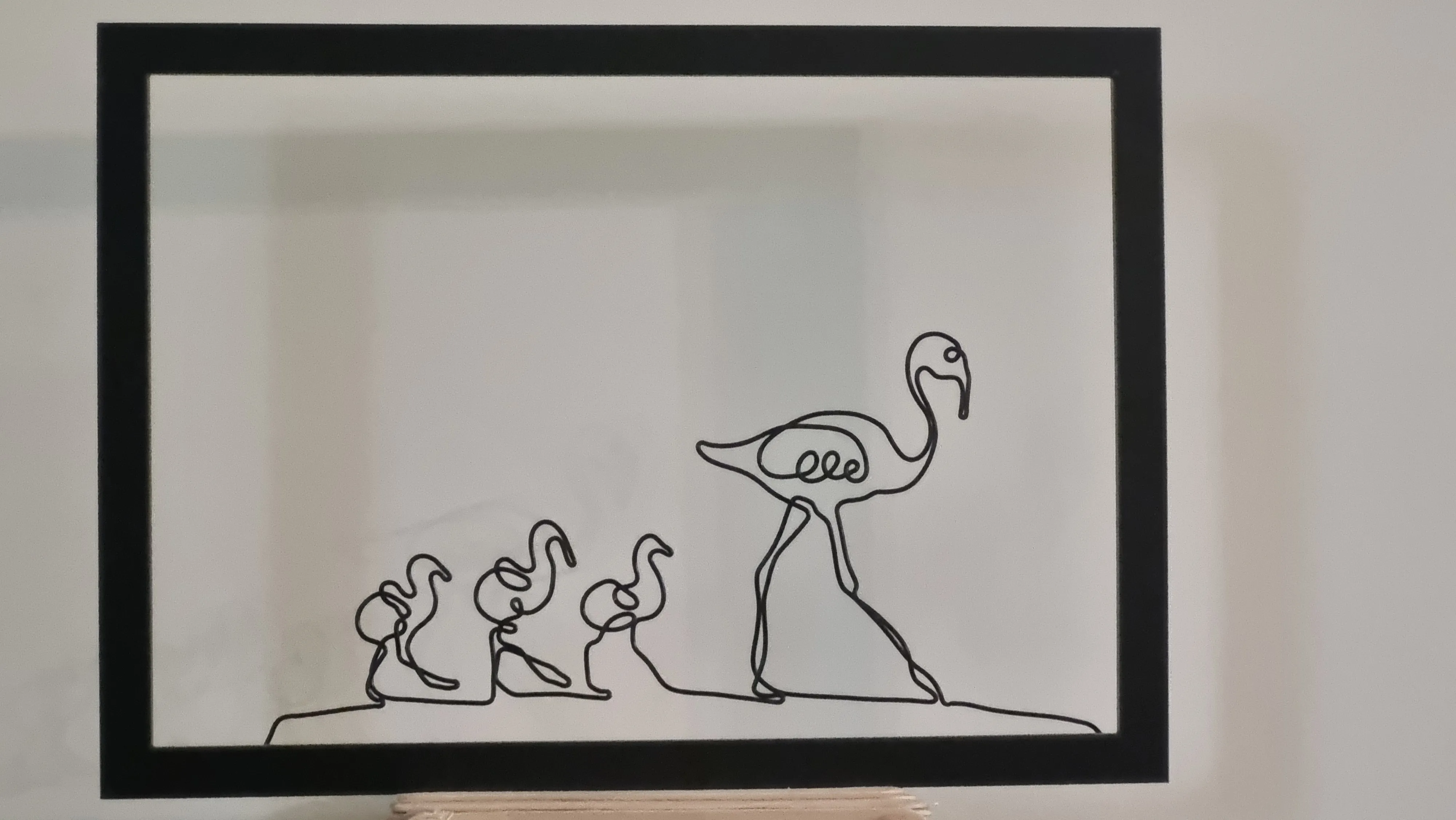 עבודת חוט ברזל בצורת משפחת ברווזים במסגרת